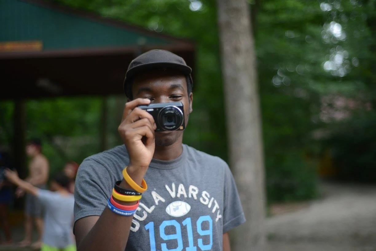 Byran at camp, taking a photo